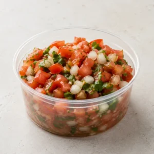 Fresh Pico de Gallo in a clear takeout sauce cup.