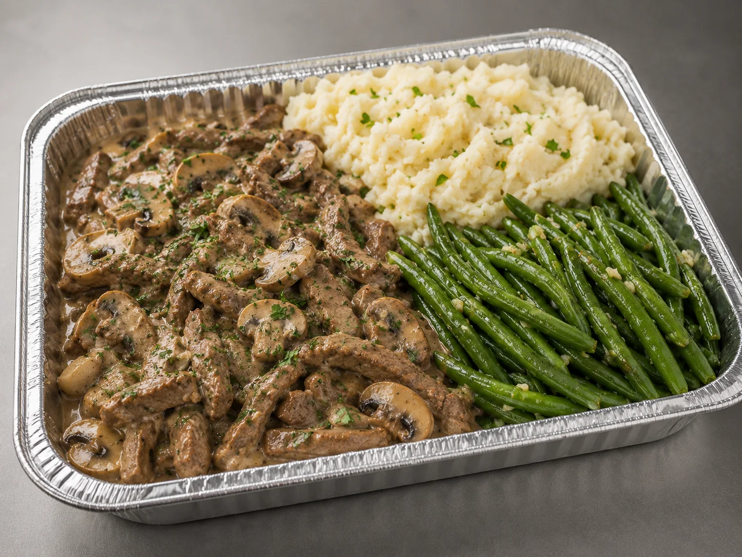 Beef Stroganoff Family Bundle in a half-size tray with creamy beef and mushrooms, mashed potatoes and green beans