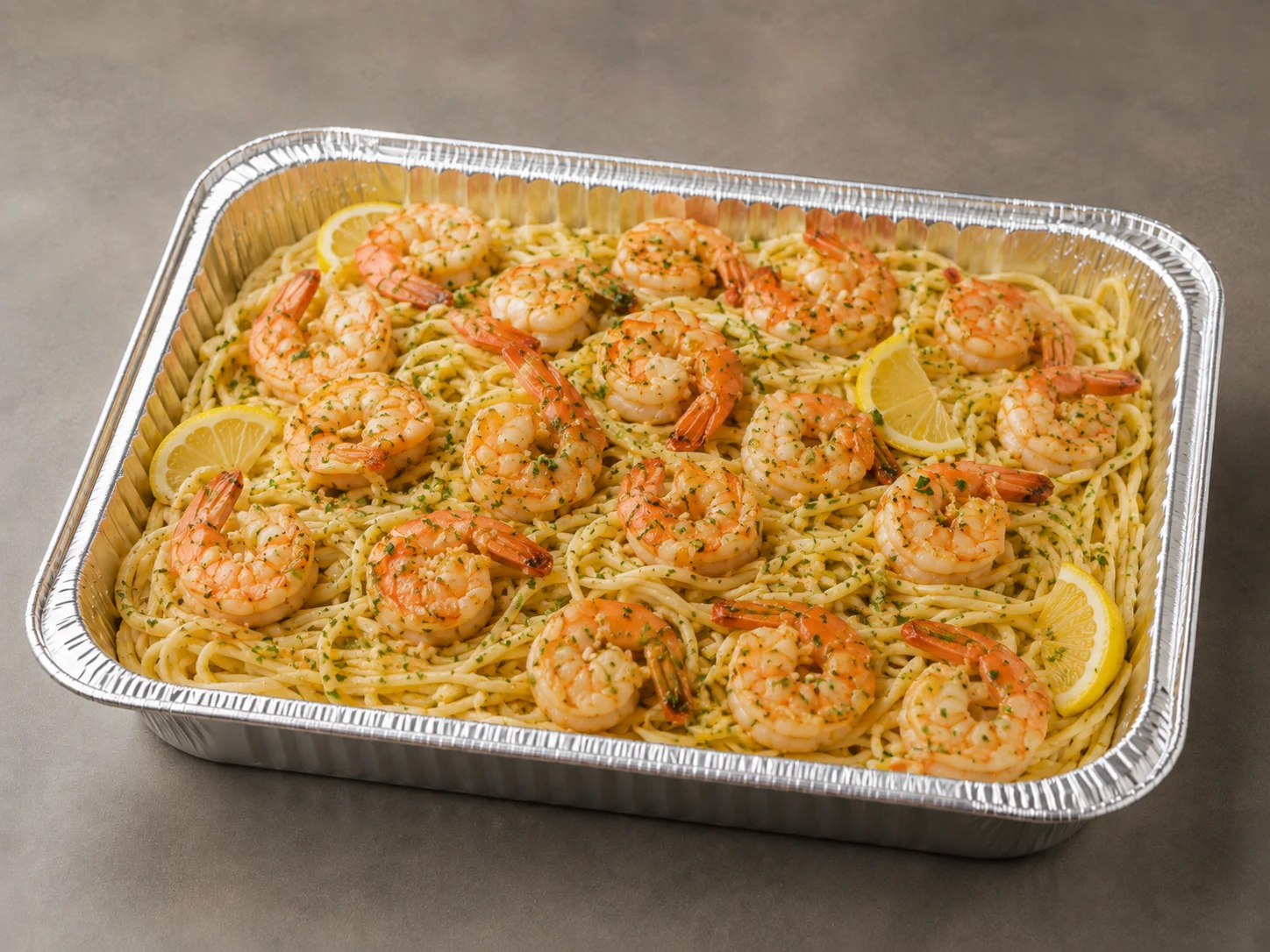 Shrimp Scampi Family Bundle with garlic-butter shrimp, thin linguine, roasted asparagus, lemon and herbs in an aluminum tray