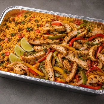 Chicken Fajita Family Bundle in a half-size aluminum tray with grilled chicken, peppers and onions