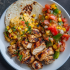 Chicken Fajita Family Bundle platter with grilled chicken, peppers, onions, pico de gallo, and avocado crema
