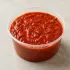 Homemade Marinara in a clear takeout sauce cup.