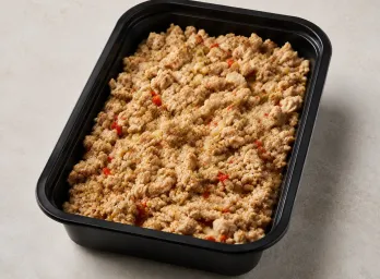 Lean Turkey Picadillo in a black meal-prep container.
