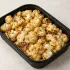 Roasted Cauliflower in a black meal-prep container.