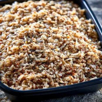 Whole Grain Medley sold by the ounce in a black meal-prep container.