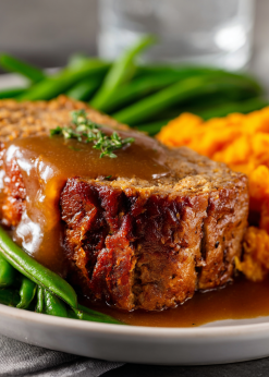 Turkey Meatloaf Family Bundle platter with turkey meatloaf, gravy, mashed sweet potatoes, and green beans