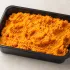 Sweet Potato Mash in a black meal-prep container.