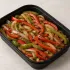 Fajita Vegetables in a black meal-prep container.