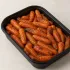 Roasted Baby Carrots in a black meal-prep container.