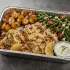 Greek Lemon Chicken Family Bundle with roasted lemon oregano chicken, potatoes and tzatziki in a half-size tray