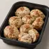 Herbed Turkey Meatballs in a black meal-prep container.