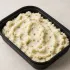 Steakhouse Mashed Potatoes in a black meal-prep container.