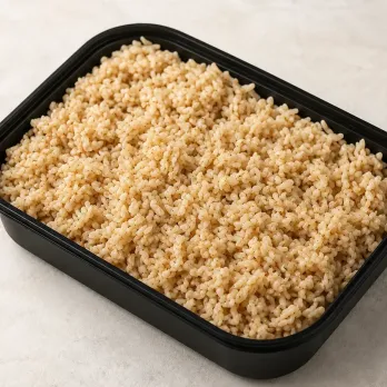 Organic Brown Rice in a black meal-prep container.