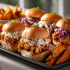 BBQ Pulled Chicken Sliders Family Bundle platter with pulled chicken, buns, coleslaw, and sweet potatoes – serves 5